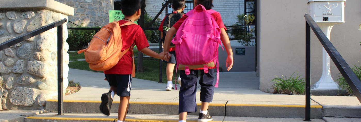 Kids Running With Backpacks